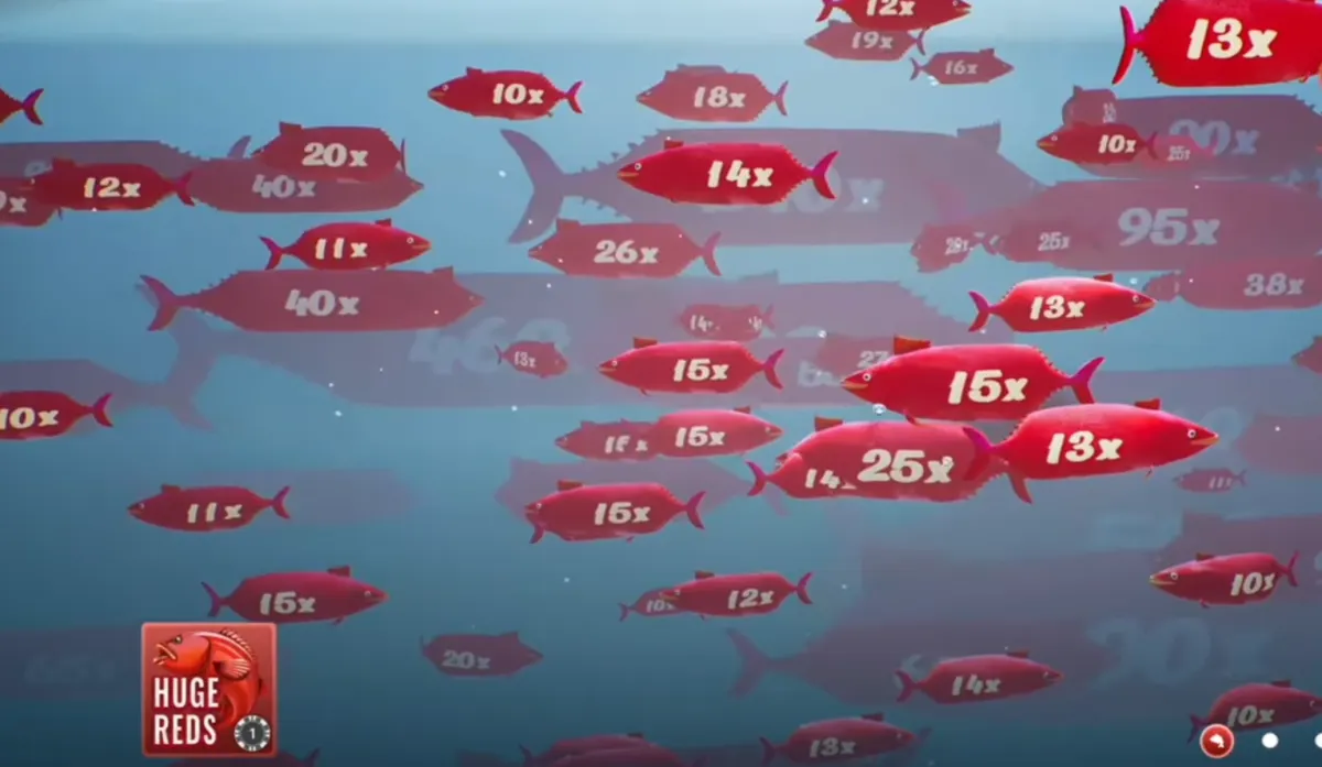 Ice Fishing Huge Reds bonus field with many red multiplier fish visible during a bonus sequence